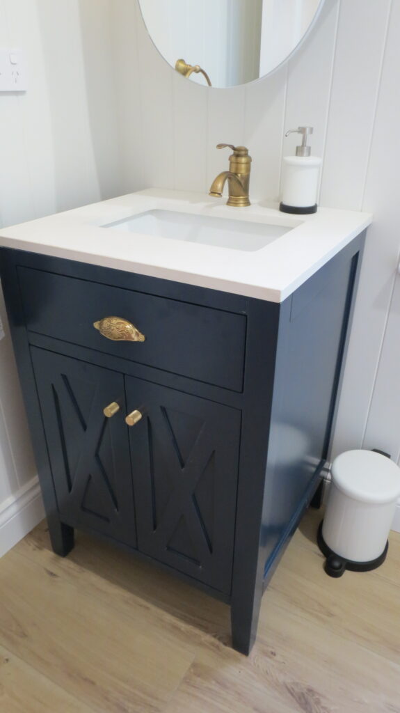 Small black vanity cabinet in small bathroom - Kangaroo Point QLD