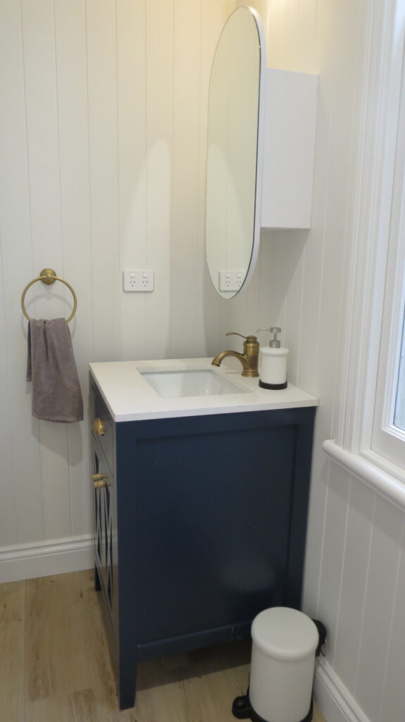 Arched mirror cabinet over black vanity - Kangaroo Point QLD