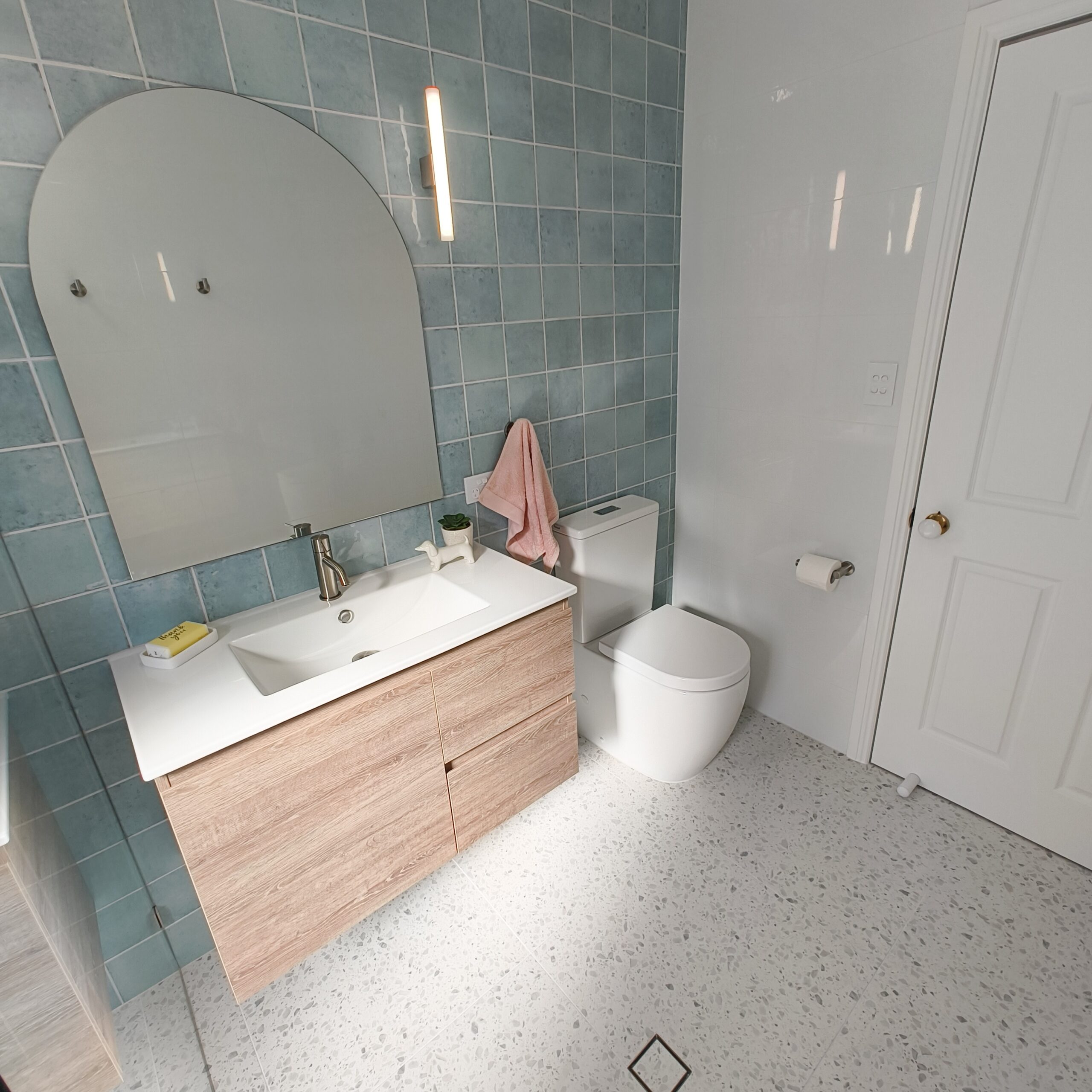 Main bathroom renovation in Yeerongpilly with walk-in shower and terrazzo-style floor tiles