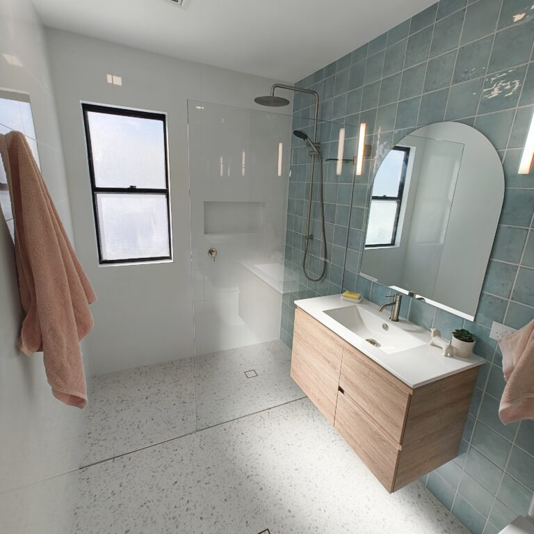 Yeerongpilly main bathroom renovation with blue feature wall and brushed nickel fixtures