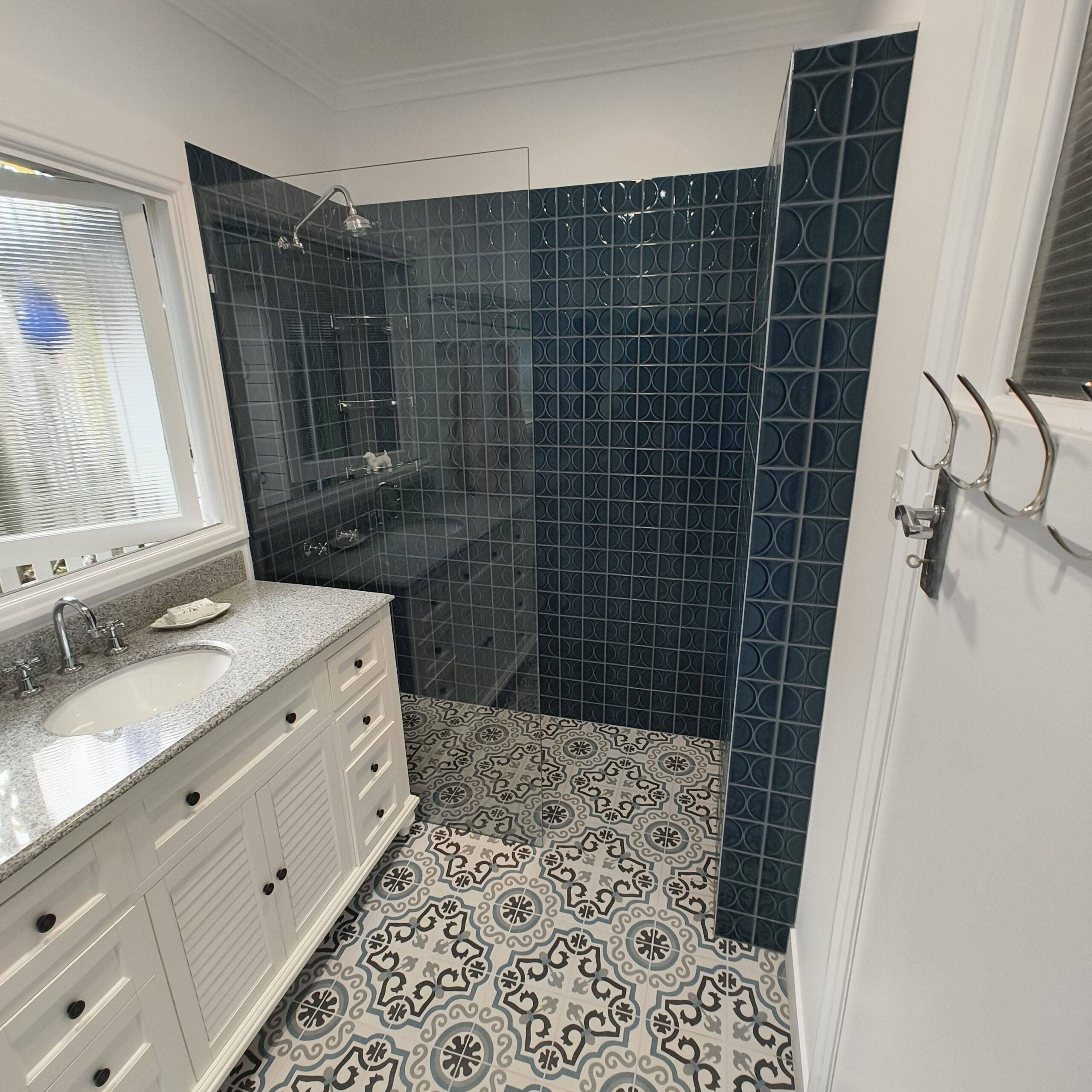 Graceville Queenslander bathroom renovation with walk-in shower, Italian green-blue feature tiles and mosaic floor