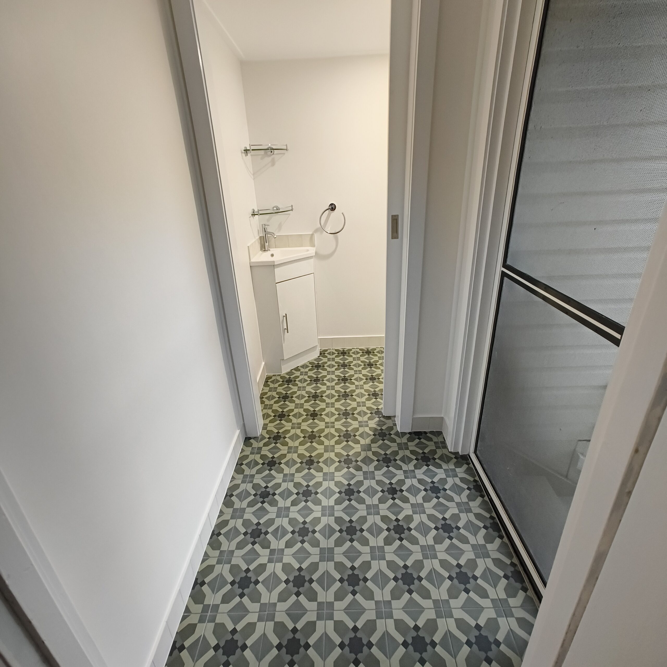 Graceville Queenslander landing after renovation with new patterned mosaic floor tiles