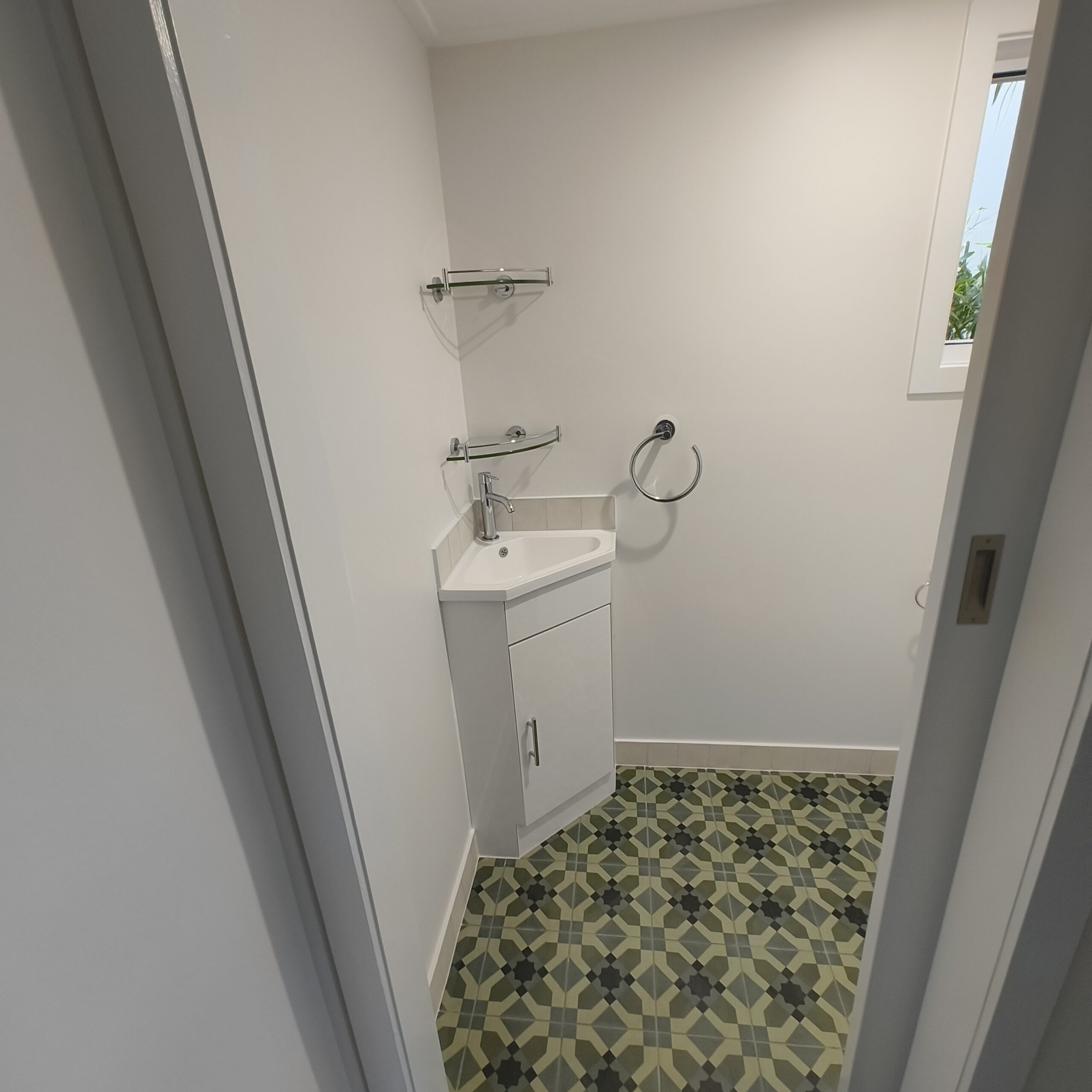 Graceville Queenslander separate toilet after renovation with corner vanity and new mosaic floor tiles