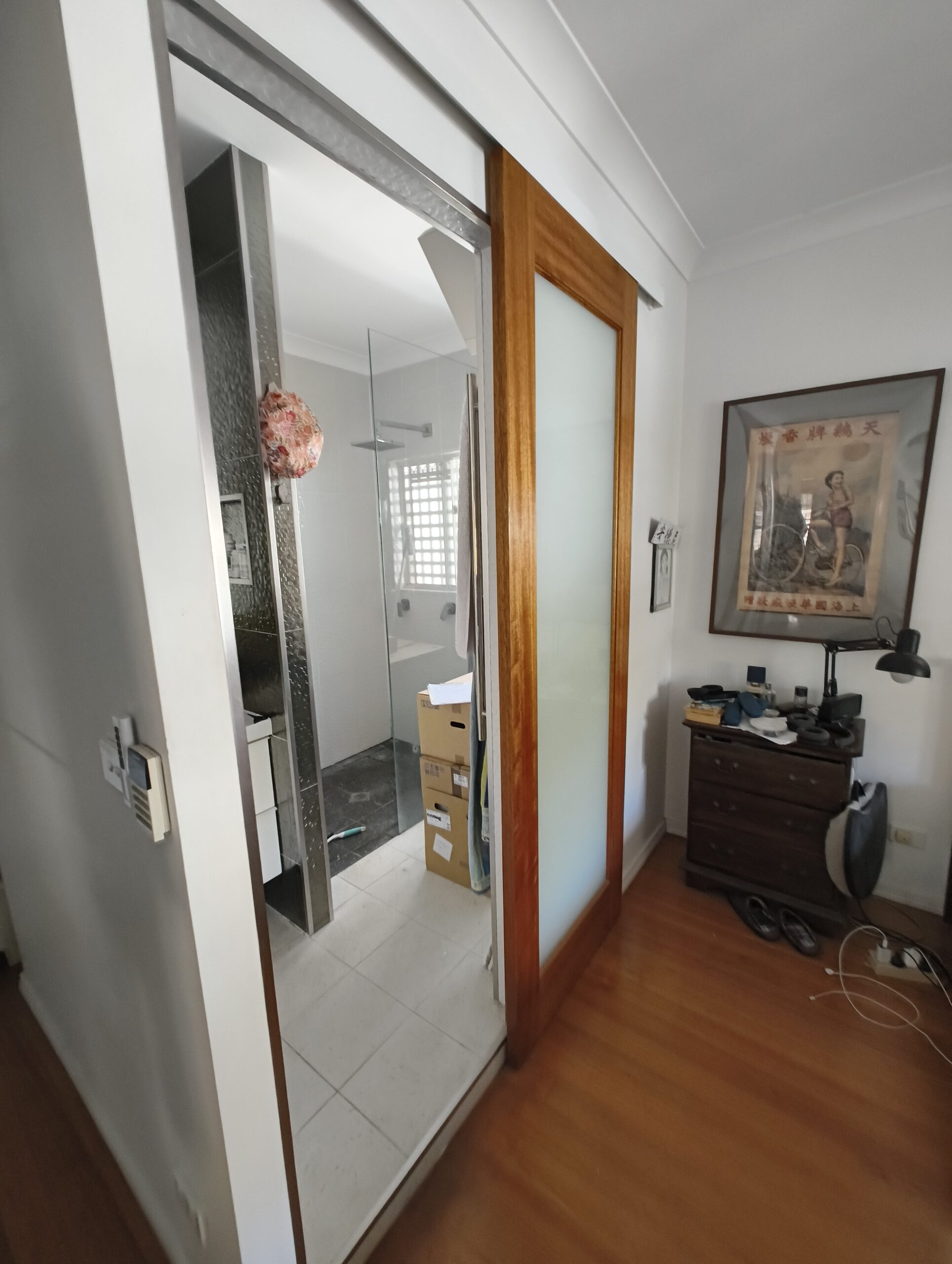 East Brisbane ensuite before renovation showing the sliding-door entry to the narrow ensuite