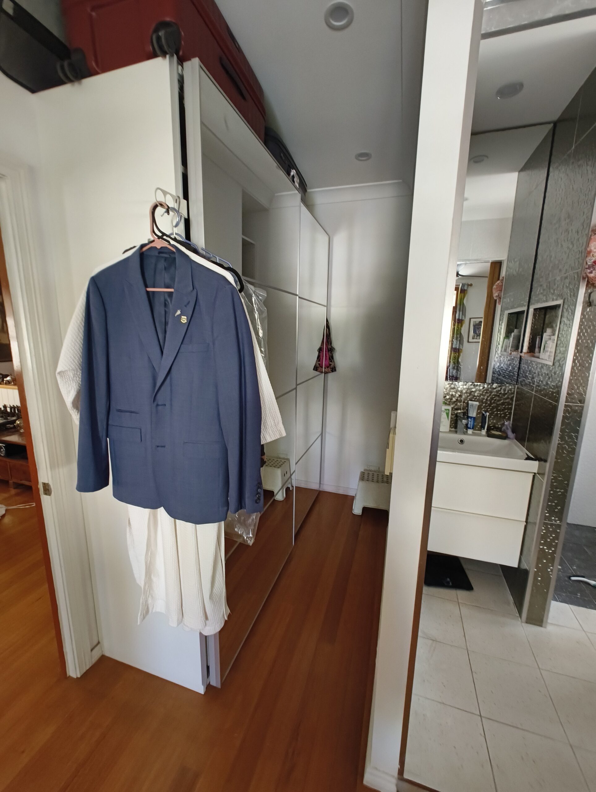 Walk-in robe beside the small ensuite before renovation in East Brisbane