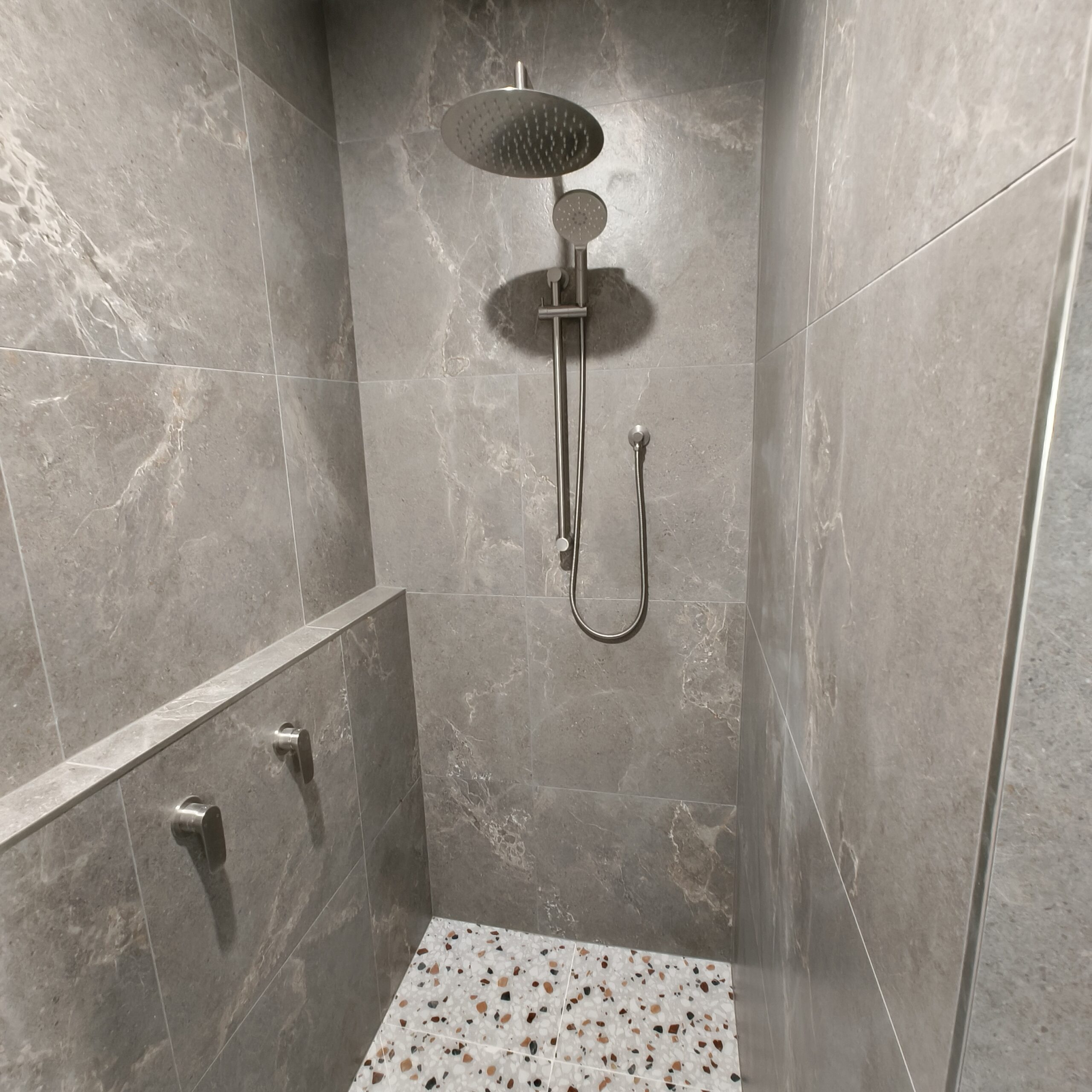 Walk-in shower with rain shower head and brushed nickel fittings in the East Brisbane ensuite renovation