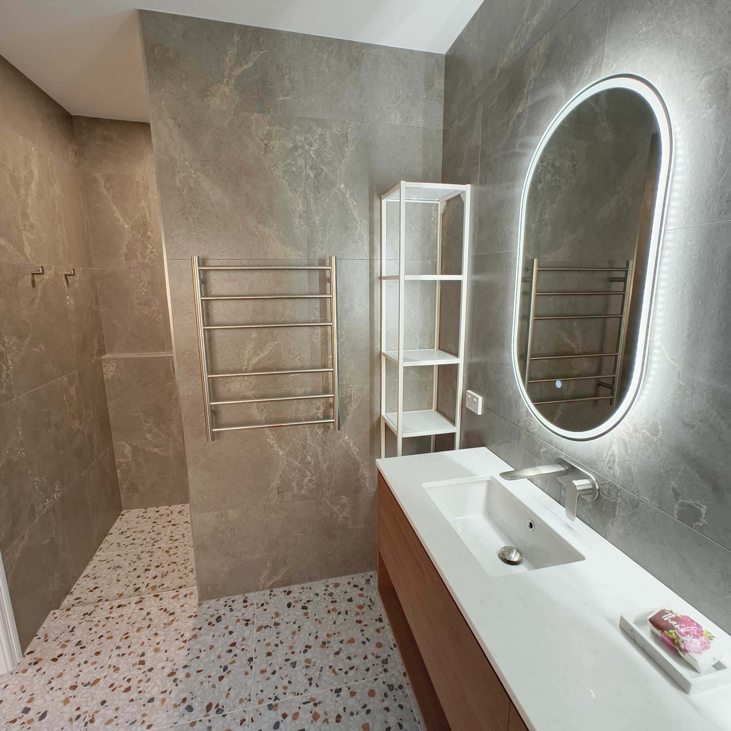 Renovated East Brisbane ensuite with open walk-in shower, heated towel rail and LED mirror
