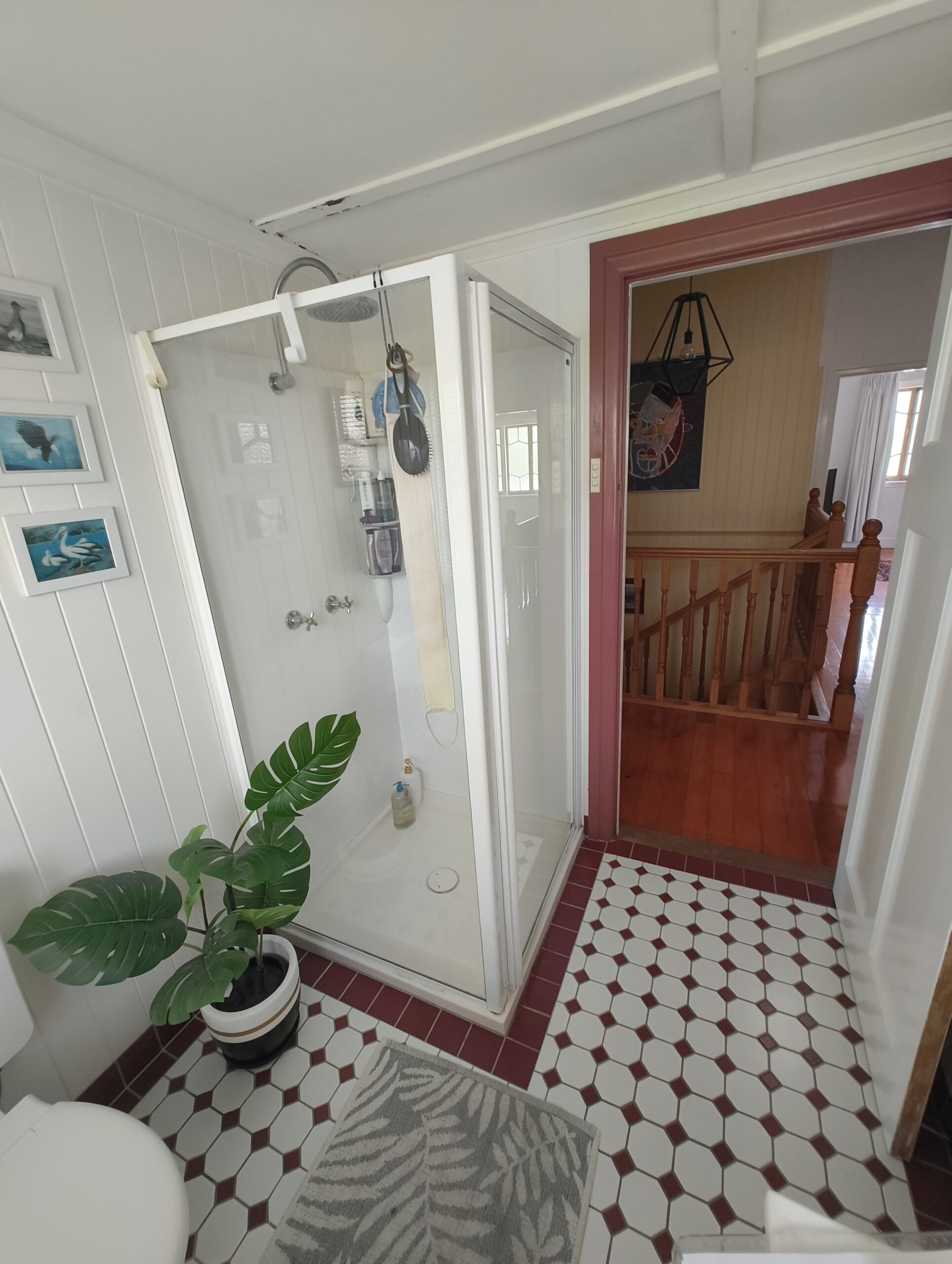 Woolloongabba main bathroom before renovation with old corner shower and heritage floor tiles