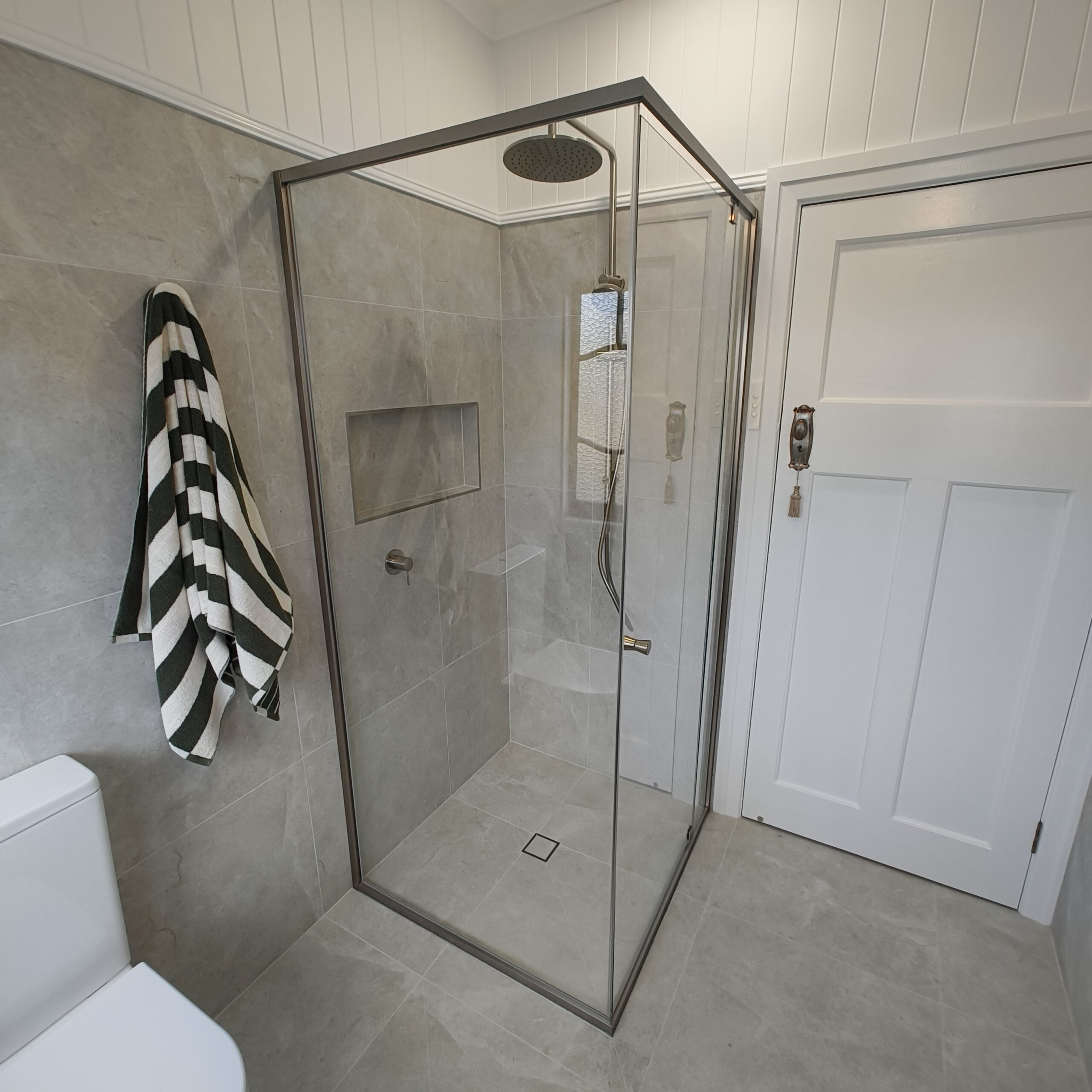 Semi-frameless shower screen and raised VJ ceiling in the Woolloongabba main bathroom renovation