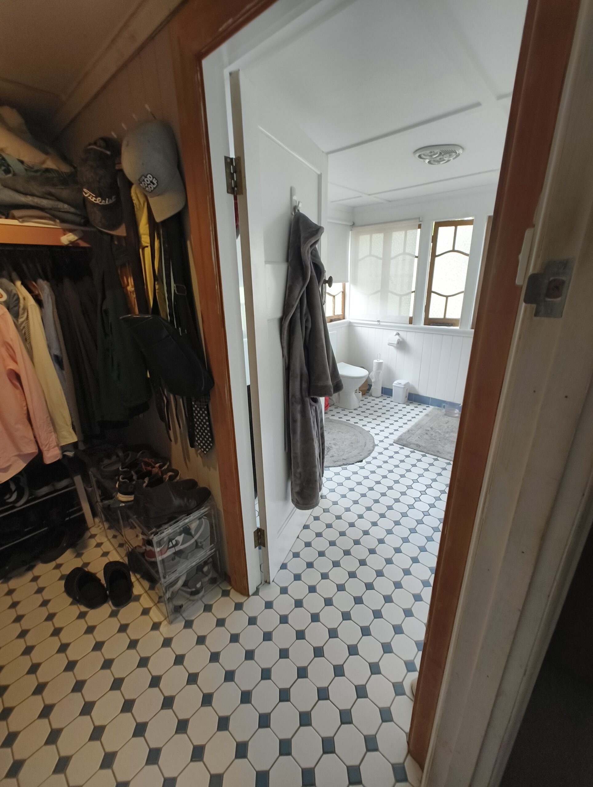 Walk-in robe before renovation showing the old ensuite entry through the robe