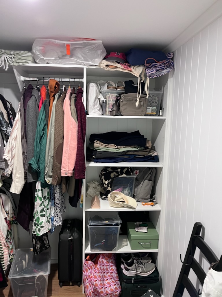 Finished walk-in robe renovation with fresh paint and new storage