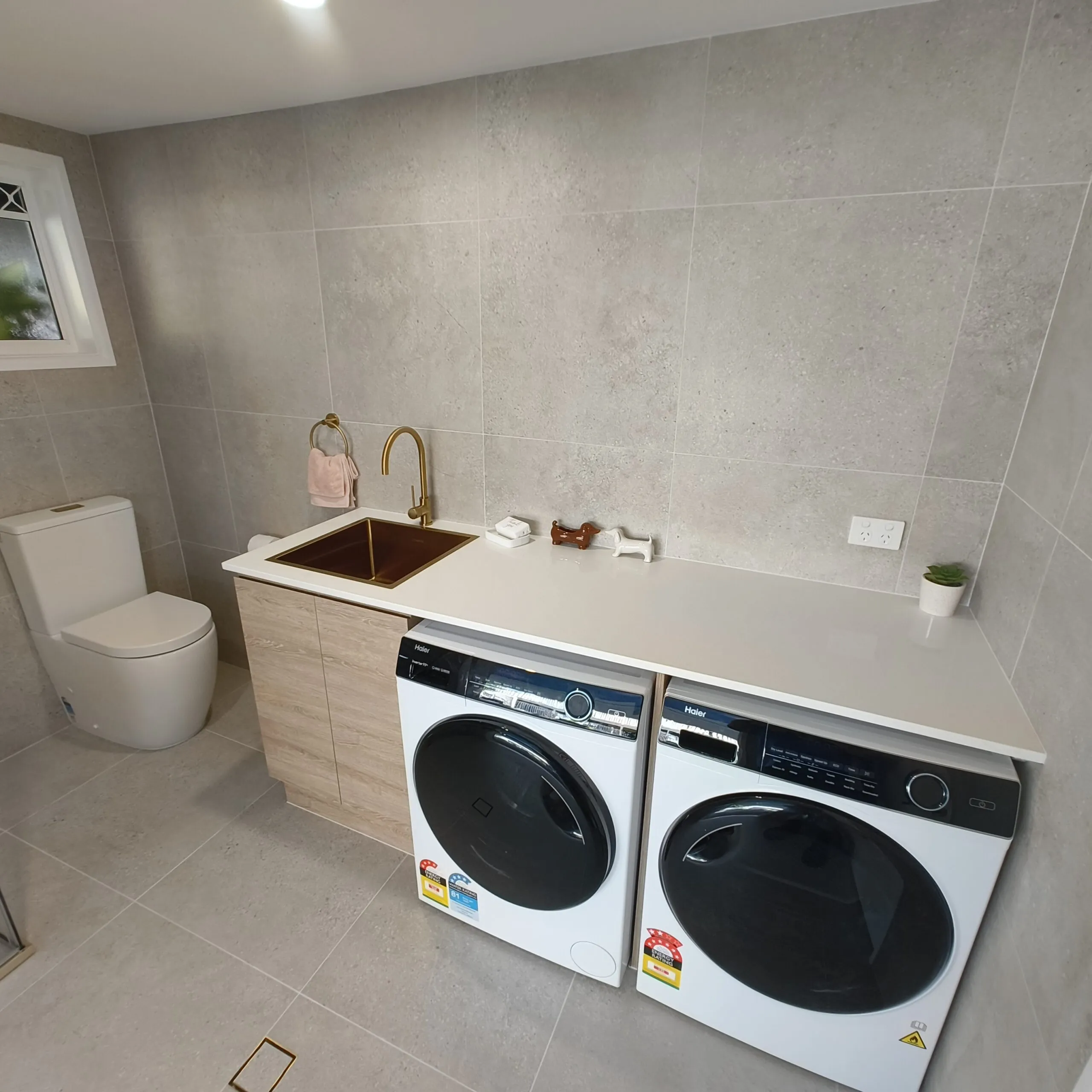 Completed Salisbury laundry renovation showing shower and streamlined tiled finish