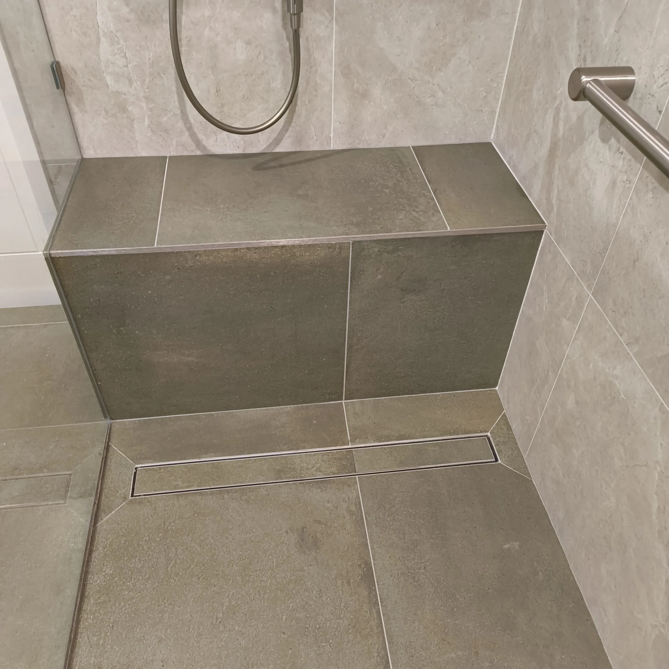 Accessible bathroom renovation with hand rails for client safety