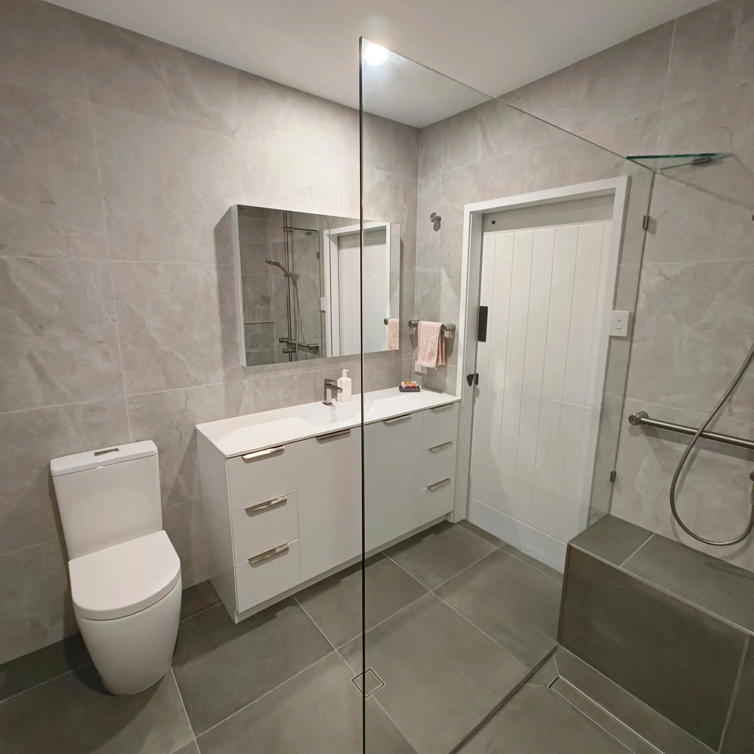 Tundra Ivory wall tiles and Khaki floor tiles in Norman Park bathroom renovation