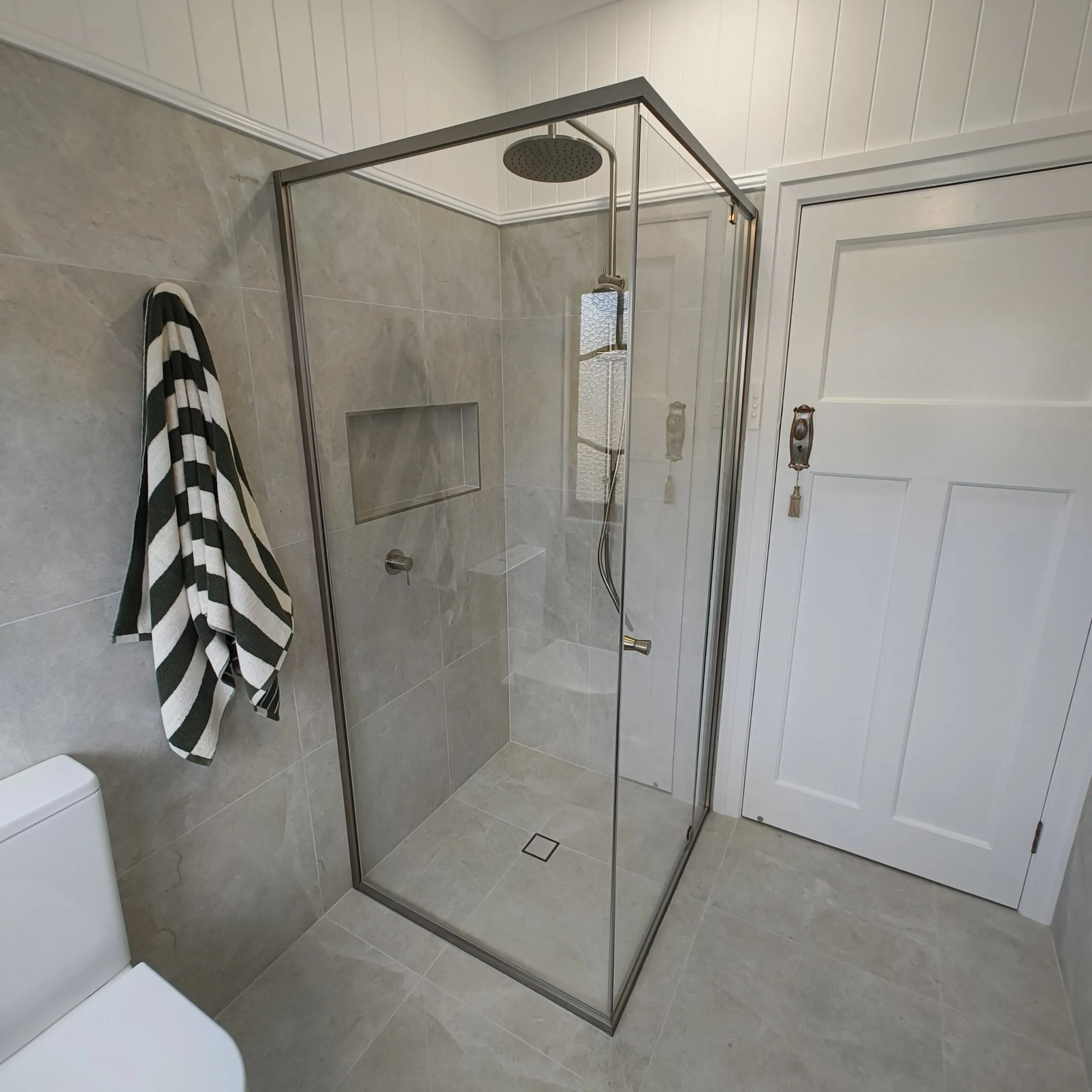 Semi-frameless shower screen and raised VJ ceiling in the Woolloongabba main bathroom renovation