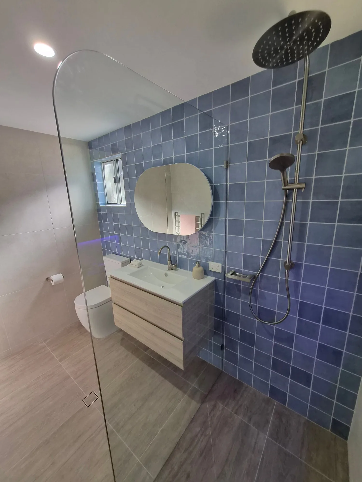 Walk-in shower with frameless screen and brushed nickel rain shower in the renovated Red Hill main bathroom